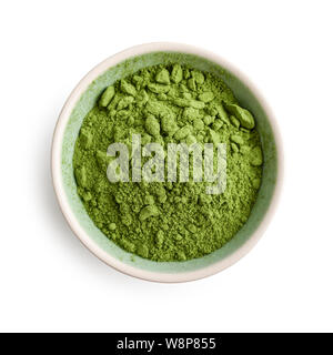 Bowl of matcha powder isolated on white background, top view Stock Photo