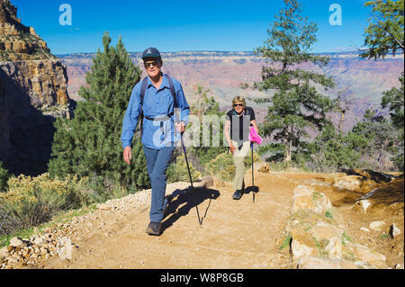 Couple climbing out of the Grand Canyon on the Bright Angel trail. Stock Photo