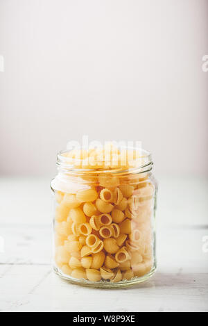 Jar of Italian whole wheat pipe rigate pasta Stock Photo