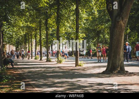 Berlin, Germany - June, 2019: People waling in public park on sunny, summer day in Berlin, Germany Stock Photo