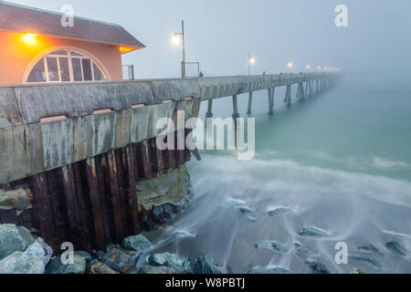 Pacifica Municipal Pier in Thick Fog and High Tide Stock Photo