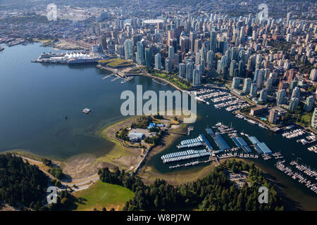 Aerial view of Coal Harbour and a modern Downtown City during a vibrant sunny morning. Taken in Vancouver, British Columbia, Canada. Stock Photo