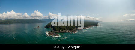 Beautiful Aerial Panoramic Landscape View of the Rocky Pacific Ocean Coast in the Southern Vancouver Island during a sunny summer day. Taken between V Stock Photo