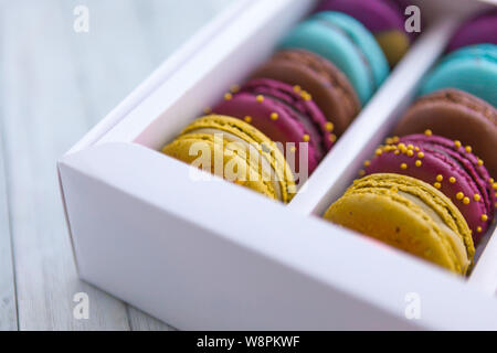 Colored macaroons in a white box, close-up Stock Photo