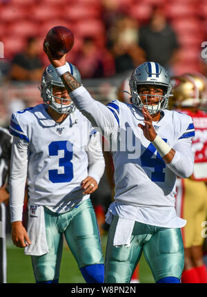 Dallas Cowboys Vs. San Francisco 49ers. NFL Match Poster. Two American  Football Players Silhouette Facing Each Other On The Field. Clubs Logo In  Background. Rivalry Concept Photo. Stock Photo, Picture and Royalty