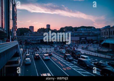 View of Ueno Station crossing before sunset. Motion blur. Landscape orientation. Stock Photo