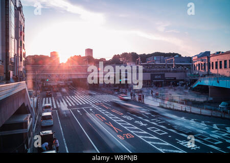 View of Ueno Station crossing before sunset. Motion blur. Landscape orientation. Stock Photo