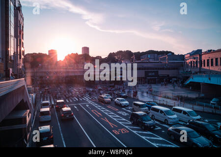 View of Ueno Station crossing before sunset. Motion blur. Landscape orientation. Stock Photo