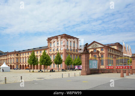 Mannheim, Germany - July 2019: Front view with gates of Mannheim Baroque Palace on summer day Stock Photo