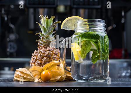 Lemonade or Mojito cocktail with lemon and mint, raspberry, sea buckthorn, grapefruit, cold refreshing drink or drink with ice. Stock Photo