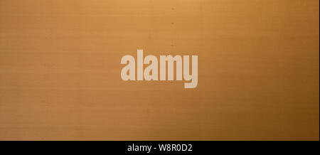 Top down view on smooth light to dark brown color gradient on wooden surface in background. Has copy space. Stock Photo