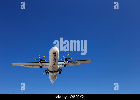 Stockholm, Sweden - May 31, 2019: Low angle view of an ATR 72-600 aircraft in service for the Braathen Regional on final at the Stockholm Bromma airpo Stock Photo