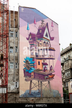 Budapest, Hungary - May 30, 2019: huge artwork on house wall that is being renovated Stock Photo