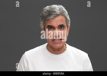 Senior man looking angry Stock Photo