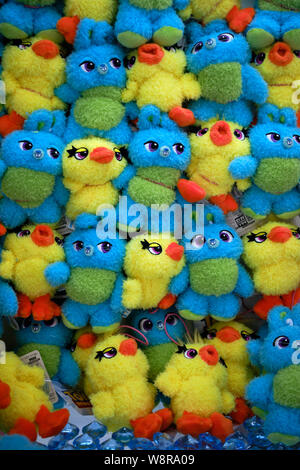 Tokyo / Japan - 31st July 2019: Soft, fluffy colourful chick and rabbit toys stacked up in a gashapon vending machine in Japan Stock Photo