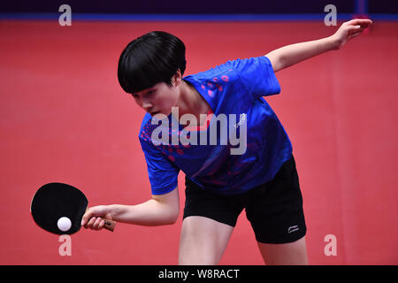 China s Zhang Qi competes against Britain s David Smith in the