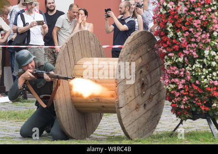Budapest, Budapest. 10th Aug, 2019. People take part in a re-enactment to mark the 75th anniversary of the outbreak of the 1944 Warsaw Uprising, in Budapest, Hungary on Aug. 10, 2019. On Aug. 1, 1944, the Polish underground resistance, led by the Polish Home Army, began a major military operation to liberate Warsaw from Nazi occupation. The uprising, which lasted 63 days, was one of the biggest resistance operations against Nazi Germany. Credit: Attila Volgyi/Xinhua Credit: Xinhua/Alamy Live News Stock Photo