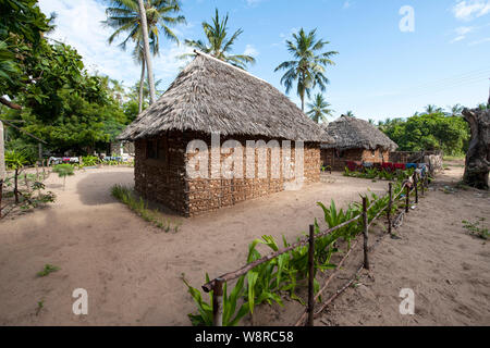 Stone and mud huts homes with thatched roofs in Kenya, Africa Stock Photo