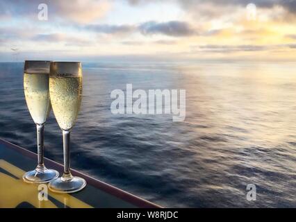 https://l450v.alamy.com/450v/w8rjdc/two-glasses-of-champagne-on-beautiful-north-sea-background-cruise-vacation-concept-w8rjdc.jpg