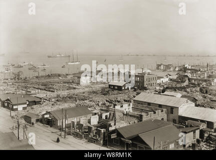 [ 1920s Japan - Aftermath of Great Kanto Earthquake, Yokohama ] —   Ruined buildings at Yokohama, Kanagawa Prefecture, shortly after the Great Kanto Earthquake (Kanto Daishinsai) of September 1, 1923 (Taisho 12). Some rebuilding has commenced.  The quake, with an estimated magnitude between 7.9 and 8.4 on the Richter scale, devastated Tokyo, the port city of Yokohama, surrounding prefectures of Chiba, Kanagawa, and Shizuoka, and claimed over 140,000 victims. Stock Photo