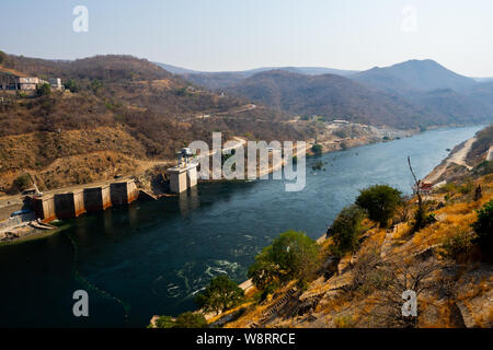 View of the Kariba hydroelectric dam in the Kariba gorge of the Zambezi river between Zimbabwe and Zambia in southern Africa. The dam forms lake Karib Stock Photo