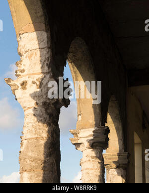 weathered arches of an old building on the Malecon in Havana Cuba. The sandstone has eroded and weathered over many years Stock Photo