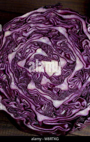 Red cabbage purple cross section close-up on a dark background Stock Photo