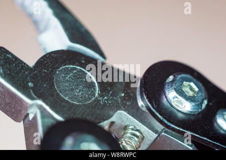 elements small foldable steel multitool, closeup, macro Stock Photo