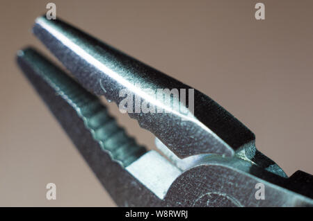 elements small foldable steel multitool, closeup, macro Stock Photo