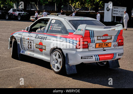1996 Ford Escort WRC with driver Lars Zander in the holding paddock at the 2019 Goodwood Festival of Speed, Sussex, UK. Stock Photo