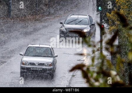 Chippenham, Wiltshire, UK. 11th August, 2019. Car drivers are pictured braving heavy rain in Chippenham as heavy rain showers make their way across Southern England. Credit: Lynchpics/Alamy Live News