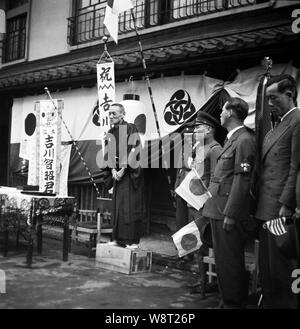 [ 1940s Japan - Japanese Soldier Departing for War ] —   A private home is decorated to bid a son going to war farewell.  20th century vintage negative film. Stock Photo