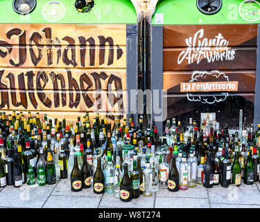 Empty glass bottles dumped in front of overflowing bottle banks, Strasbourg, Alsace, France, Europe, Stock Photo