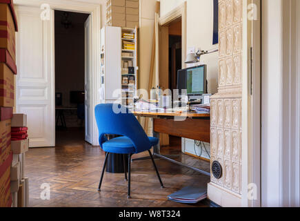 Blue chair, office interior, busy desk, France, Europe, Stock Photo