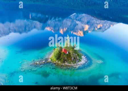 Eibsee lake with Schonbichl Island and water reflection of the Zugspitze in the morning light, near Grainau, Werdenfelser Land, aerial photo, Upper Stock Photo
