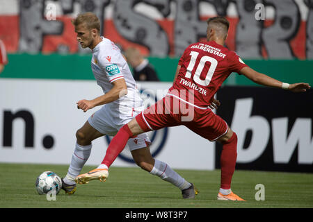 Halberstadt, Germany. 11th Aug, 2019. Soccer: DFB Cup, Germania Halberstadt - 1st FC Union Berlin, 1st round in Friedensstadion. Berlin's Sebastian Andersson (l) plays against Halberstadt's Patrik Twardzik. Credit: Swen Pförtner/dpa - IMPORTANT NOTE: In accordance with the requirements of the DFL Deutsche Fußball Liga or the DFB Deutscher Fußball-Bund, it is prohibited to use or have used photographs taken in the stadium and/or the match in the form of sequence images and/or video-like photo sequences./dpa/Alamy Live News Stock Photo