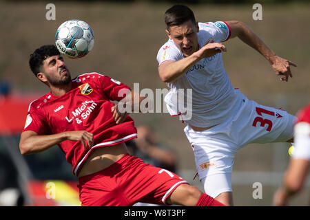 Halberstadt, Germany. 11th Aug, 2019. Soccer: DFB Cup, Germania Halberstadt - 1st FC Union Berlin, 1st round in Friedensstadion. Halberstadt's Batikan Yilmaz (l) plays against Berlin's Keven Schlotterbeck. Credit: Swen Pförtner/dpa - IMPORTANT NOTE: In accordance with the requirements of the DFL Deutsche Fußball Liga or the DFB Deutscher Fußball-Bund, it is prohibited to use or have used photographs taken in the stadium and/or the match in the form of sequence images and/or video-like photo sequences./dpa/Alamy Live News Stock Photo
