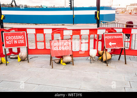 Footpath and pedestrian crossing closedbeacuse of a construction area Stock Photo