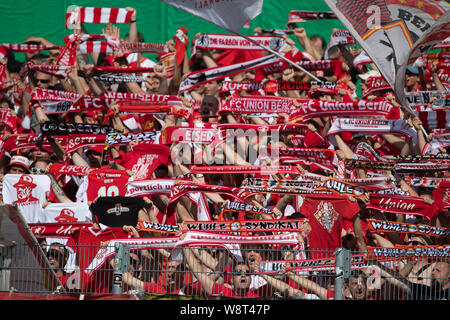 Halberstadt, Germany. 11th Aug, 2019. Soccer: DFB Cup, Germania Halberstadt - 1st FC Union Berlin, 1st round in Friedensstadion. Fans of Union Berlin show scarves. Credit: Swen Pförtner/dpa - IMPORTANT NOTE: In accordance with the requirements of the DFL Deutsche Fußball Liga or the DFB Deutscher Fußball-Bund, it is prohibited to use or have used photographs taken in the stadium and/or the match in the form of sequence images and/or video-like photo sequences./dpa/Alamy Live News Stock Photo