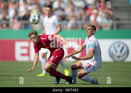 Halberstadt, Germany. 11th Aug, 2019. Soccer: DFB Cup, Germania Halberstadt - 1st FC Union Berlin, 1st round in Friedensstadion. Berlin's Keven Schlotterbeck (r) plays against Halberstadt's Justin Bretgeld. Credit: Swen Pförtner/dpa - IMPORTANT NOTE: In accordance with the requirements of the DFL Deutsche Fußball Liga or the DFB Deutscher Fußball-Bund, it is prohibited to use or have used photographs taken in the stadium and/or the match in the form of sequence images and/or video-like photo sequences./dpa/Alamy Live News Stock Photo