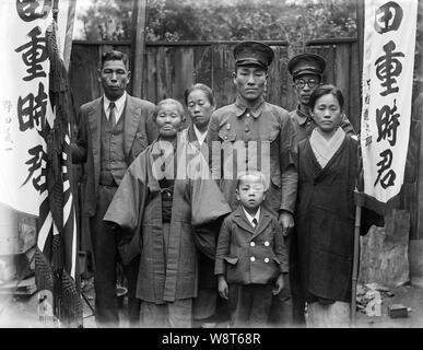 [ 1940s Japan - Japanese Soldier Departing for War ] —   A family bids farewell to a son going to war.  20th century vintage glass negative. Stock Photo
