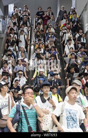 Tokyo, Japan. 11th Aug, 2019. Visitors gather at the Comic Market (Comiket) 96 event in Tokyo Big Sight. Many manga fans and cosplayers lined up despite to the hot weather in Tokyo, which temperature reached 35.5 degrees Celsius, in the second day of the Comiket. The Comic Market was established in 1975 and focuses on manga, anime, gaming and cosplay. Organizers expect more than 200,000 visitors per day to attend the event which runs for fourth days until August 12. Credit: Rodrigo Reyes Marin/ZUMA Wire/Alamy Live News Stock Photo