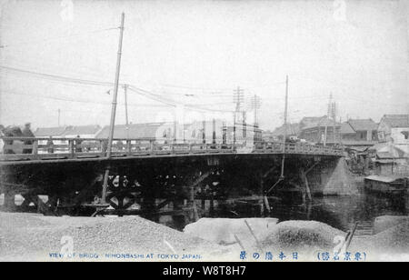 [ 1900s Japan - Old Wooden Nihonbashi Bridge, Tokyo ] —   The wooden Nihonbashi Bridge (日本橋) in Tokyo, shortly before it was replaced by a stone bridge n 1911 (Meiji 44). During the Edo Period (1600-1867), the bridge was the starting point of the famous Tokaido and the other 4 post roads.  20th century vintage postcard. Stock Photo