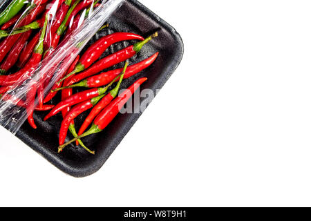 Red chili in foam and plastic package Stock Photo