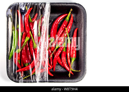 Red chili in foam and plastic package Stock Photo