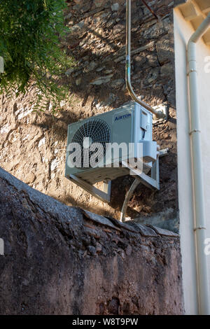 Air Conditioning exterior unit on French house wall Stock Photo