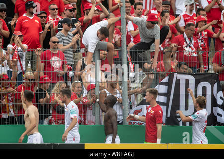 Halberstadt, Germany. 11th Aug, 2019. Soccer: DFB Cup, Germania Halberstadt - 1st FC Union Berlin, 1st round in Friedensstadion. Berlin's players kill off after the game with the fans. Credit: Swen Pförtner/dpa - IMPORTANT NOTE: In accordance with the requirements of the DFL Deutsche Fußball Liga or the DFB Deutscher Fußball-Bund, it is prohibited to use or have used photographs taken in the stadium and/or the match in the form of sequence images and/or video-like photo sequences./dpa/Alamy Live News Stock Photo