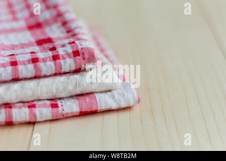 stack of kitchen towels on light wooden background Stock Photo