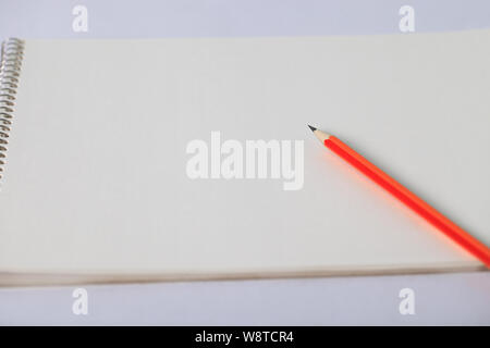 Close up of a pencil on a notebook Stock Photo