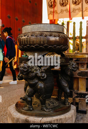 Traditional bronze bassin at the entrance of Naras Todaiji shows mythical creatures with fine details of artwork, Japan November 2018 Stock Photo
